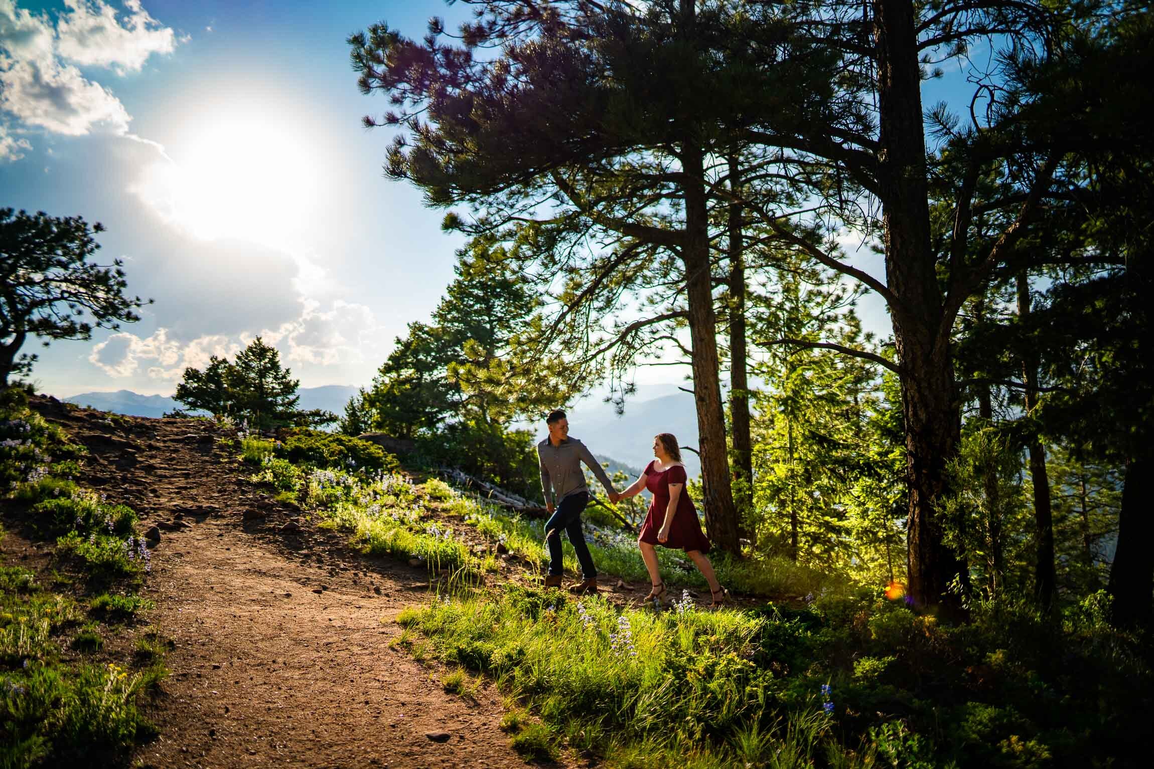 Engaged couple take portraits in a field of wildflowers in a forest during golden hour, Engagement Session, Engagement Photos, Engagement Photos Inspiration, Engagement Photography, Engagement Photographer, Summer Engagement Photos, Mountain Engagement Photos, Lost Gulch Overlook engagement session, Lost Gulch Overlook engagement photos, Lost Gulch Overlook engagement photography, Lost Gulch Overlook engagement photographer, Lost Gulch Overlook  engagement inspiration, Boulder engagement session, Boulder engagement photos, Boulder engagement photography, Boulder engagement photographer, Boulder engagement inspiration, Colorado engagement session, Colorado engagement photos, Colorado engagement photography, Colorado engagement photographer, Colorado engagement inspiration