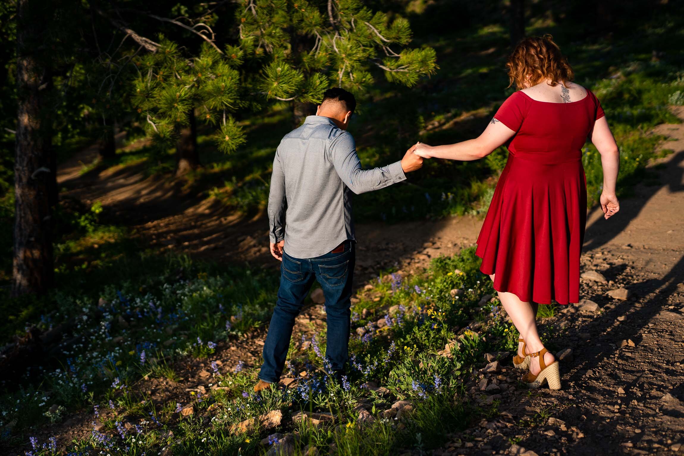 Engaged couple take portraits in a field of wildflowers in a forest during golden hour, Engagement Session, Engagement Photos, Engagement Photos Inspiration, Engagement Photography, Engagement Photographer, Summer Engagement Photos, Mountain Engagement Photos, Lost Gulch Overlook engagement session, Lost Gulch Overlook engagement photos, Lost Gulch Overlook engagement photography, Lost Gulch Overlook engagement photographer, Lost Gulch Overlook  engagement inspiration, Boulder engagement session, Boulder engagement photos, Boulder engagement photography, Boulder engagement photographer, Boulder engagement inspiration, Colorado engagement session, Colorado engagement photos, Colorado engagement photography, Colorado engagement photographer, Colorado engagement inspiration