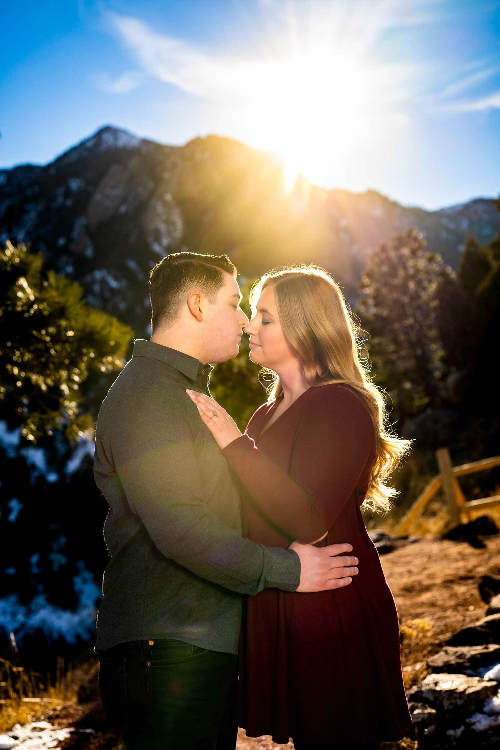 Engaged couple poses for portraits with the flatiron mountains in the background, Mountain Engagement Photos, Engagement Session, Engagement Photos, Engagement Photos Inspiration, Engagement Photography, Engagement Photographer, Engagement Portraits, Winter Engagement Photos, Snow Engagement Photos, Boulder engagement session, Boulder engagement photos, Boulder engagement photography, Boulder engagement photographer, Boulder engagement inspiration, NCAR Trail engagement session, NCAR Trail engagement photos, NCAR Trail engagement photography, NCAR Trail engagement photographer, NCAR Trail engagement inspiration, Colorado engagement session, Colorado engagement photos, Colorado engagement photography, Colorado engagement photographer, Colorado engagement inspiration, Flatiron Engagement Photos, Chautauqua Engagement Photos